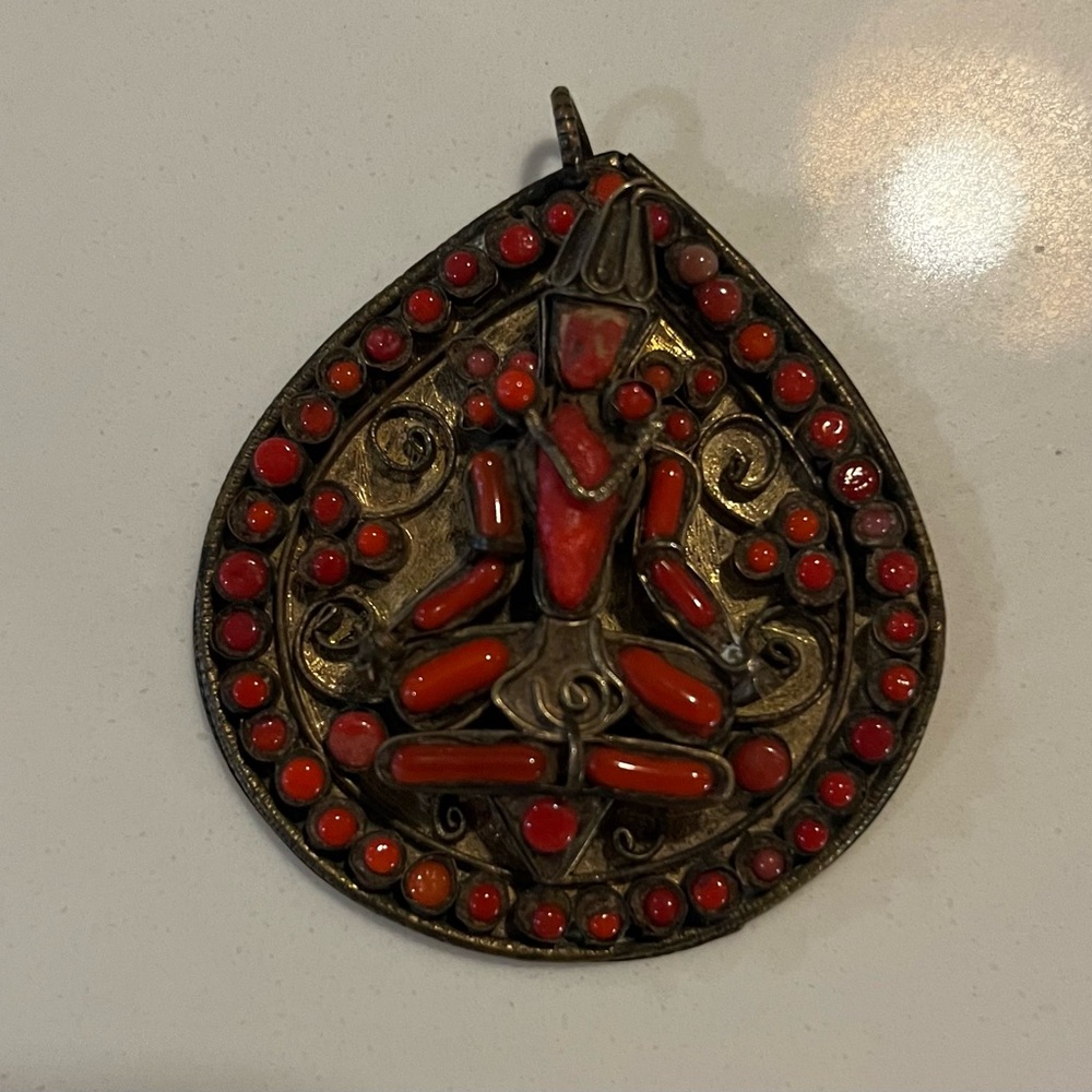 Vintage Tibetan Brass and red coral deity pendant